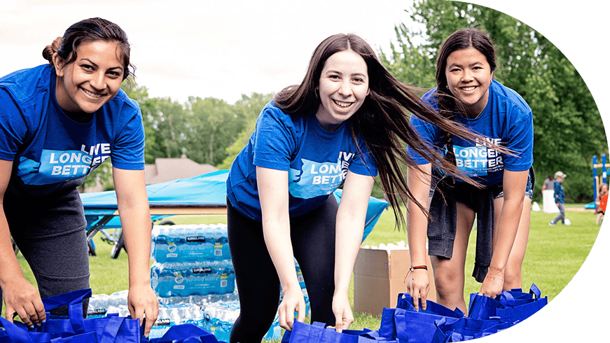 Three women volunteering at a Blue Zones Project event